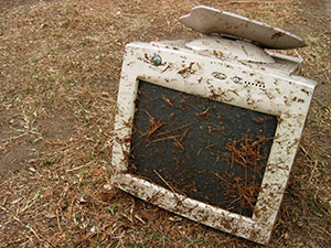 Old CRT monitor covered in debris